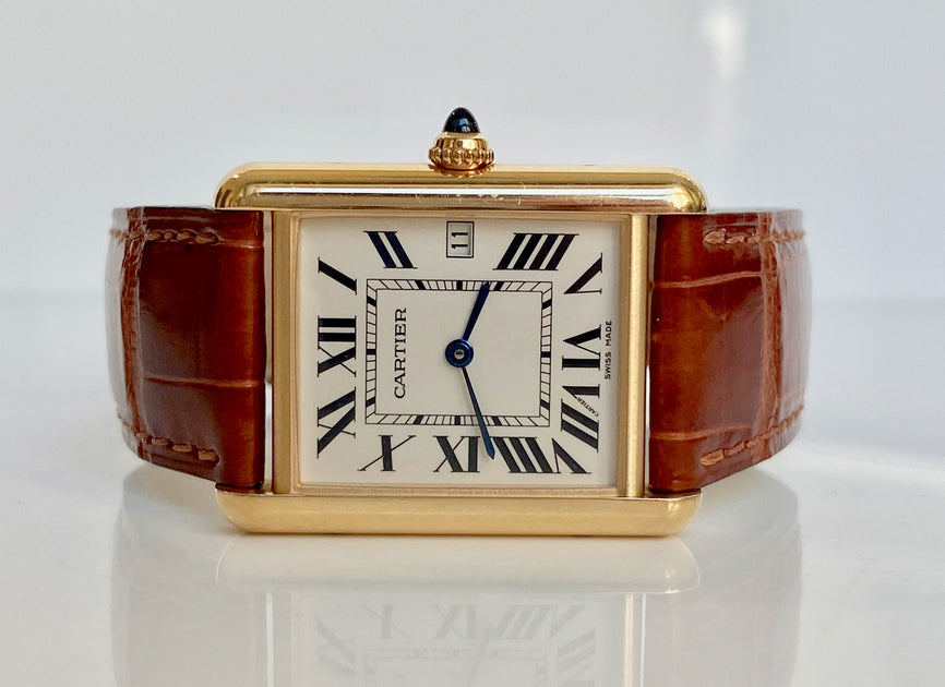 Bernie Robbins Jewelers - The Tank Louis Cartier watch is a beautifully  crafted, stylish timepiece. With an 18k yellow gold case and an  alligator-skin strap, this Cartier watch is a perfect way