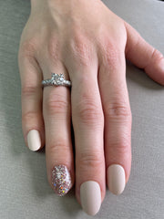 Shown on handthis antique ring in platinum setting, and six accent diamonds come together in perfect harmony.
