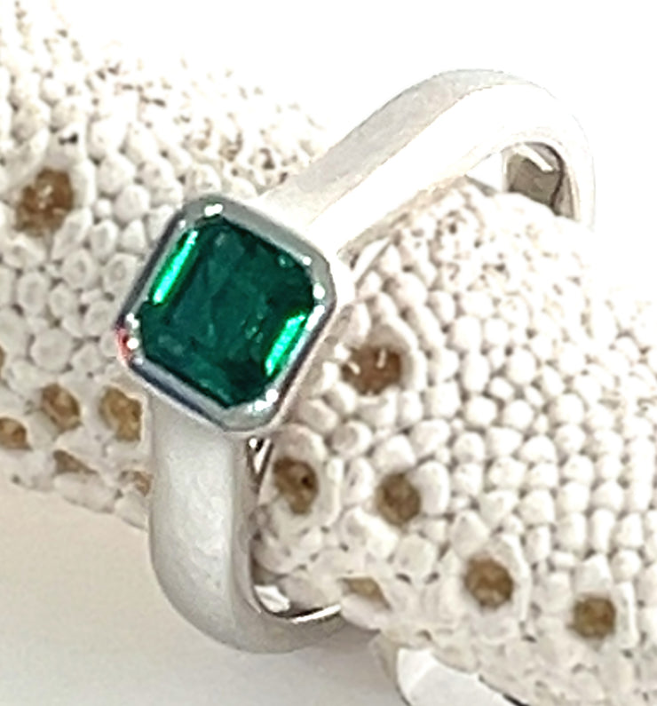 Emerald white gold bezel ring