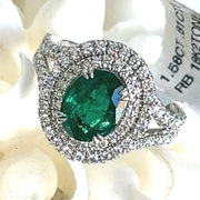 Emerald with double halo diamond ring