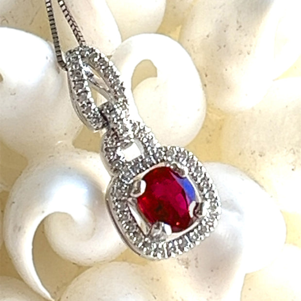 Ruby and diamond halo pendant