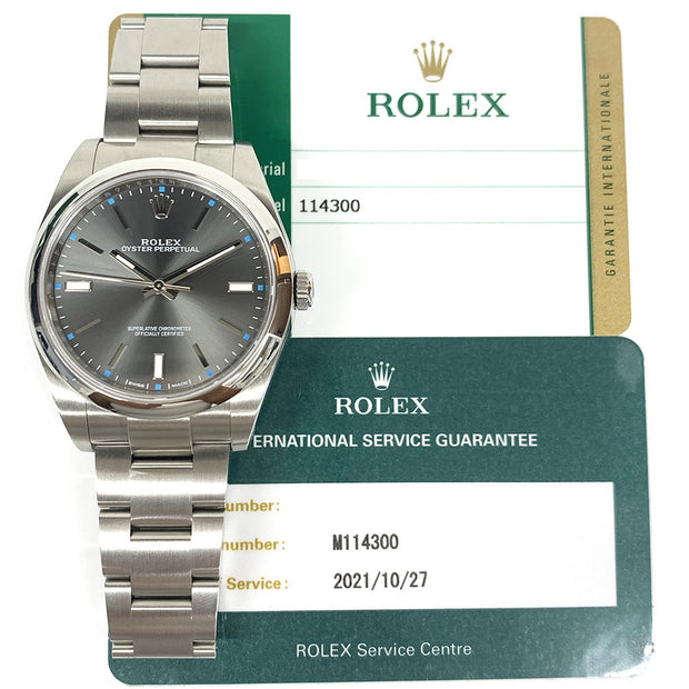 Pre-owned Rolex Oyster Perpetual 114300 Rhodium Dial watch with original box and papers Mint