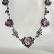 Vintage heart-shaped amethyst necklace with an 18ct rose-cut amethyst, surrounded by intricate detailed gold accents.gold.