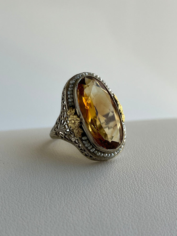 Citrine and Seed Pearl Ring in 14K 
Features a vibrant 6.25ct citrine surrounded by a delicate halo of seed pearls.
