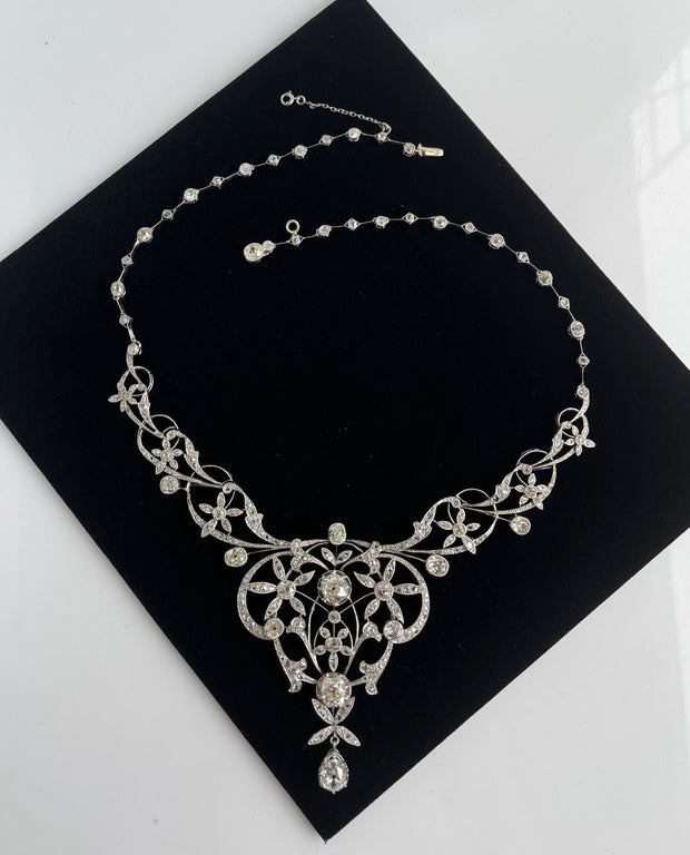 Delicate rose-cut diamond accents 2 carats total add soft shimmer and antique charm.