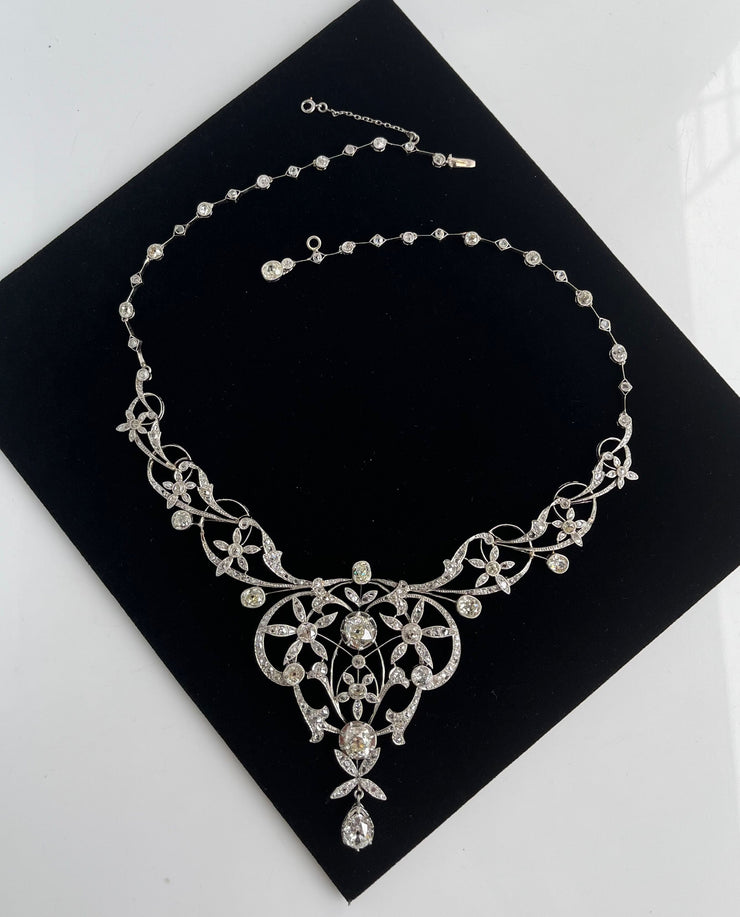 Delicate rose-cut diamond accents 2 carats total add soft shimmer and antique charm.