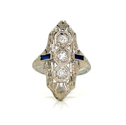 Three round diamonds and two baguette sapphires on each side, together creating a harmonious and radiant design.