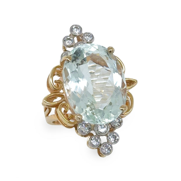 Two-Tone Gold Estate Ring featuring a stunning 16.84 ct aquamarine and 0.4 ct diamonds.