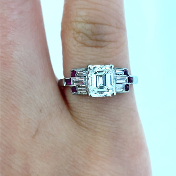 Art Deco diamond and ruby ring on finger
