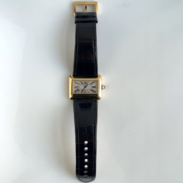 A full picture showcasing the cartier iconic mini tank divan watch.