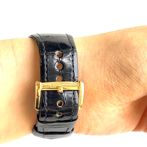 Detailin gon the tang buckle show the iconic Cartier signature.