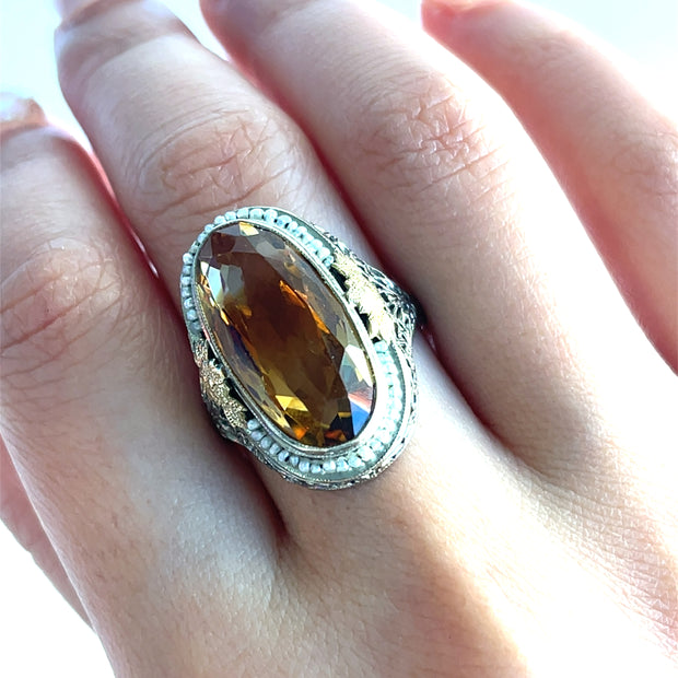  Citrine and Seed Pearl Ring in 14K 
Features a vibrant 6.25ct citrine surrounded by a delicate halo of seed pearls.