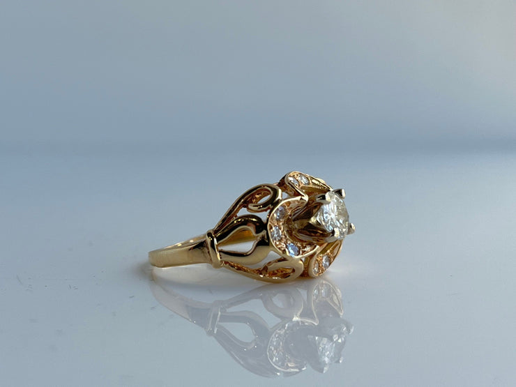 Side view showing the delicate goldwork and setting.