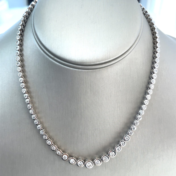 Close-up view of the necklace highlighting the 7.0 ctw total carat weight of round brilliant diamonds, showcasing their brilliance and the modern bezel setting.