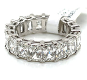 A breathtaking full view of the platinum infinite band, showcasing the seamless row of radiant cut diamonds set in a shared prong setting. The clean lines and symmetrical brilliance highlight the elegance and boldness of this timeless piece.