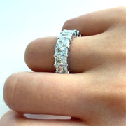 A detailed close-up reveals the exceptional clarity and faceting of the VS1 radiant cut diamonds. Each stone sparkles with fire and precision, allowing you to see the fine craftsmanship behind every setting.