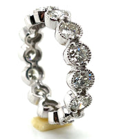 Another angle showcasing the round brilliant diamonds set in white gold.