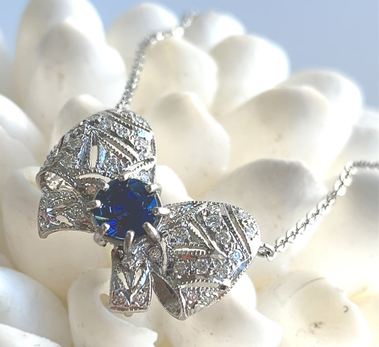 A close look at the geometric detailing on the bow pendant.