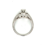 A timeless diamond ring with milgrain borders and engraved platinum, designed to be cherished.