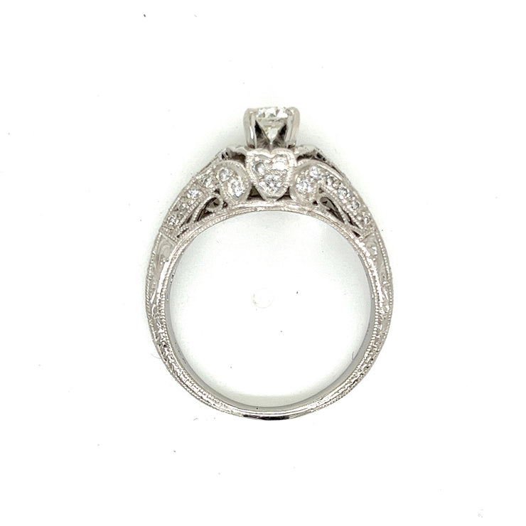A timeless diamond ring with milgrain borders and engraved platinum, designed to be cherished.