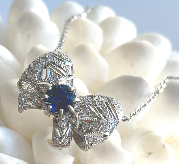 Natural 0.85 CT Sapphire Center Stone with Natural 0.50 CTW Diamond Bow 18K White Gold Pendant and 14K White Gold Chain