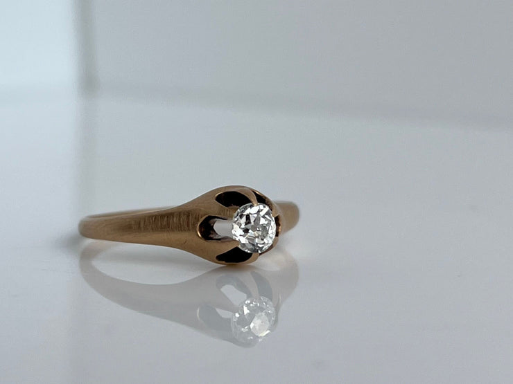 Close-up showing the antique diamond’s faceting and age-appropriate wear.
