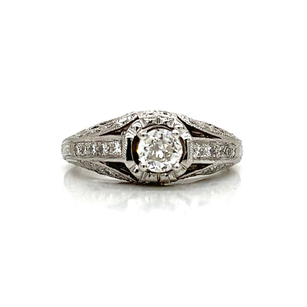 A timeless engagement ring with subtle brilliance and antique charm.