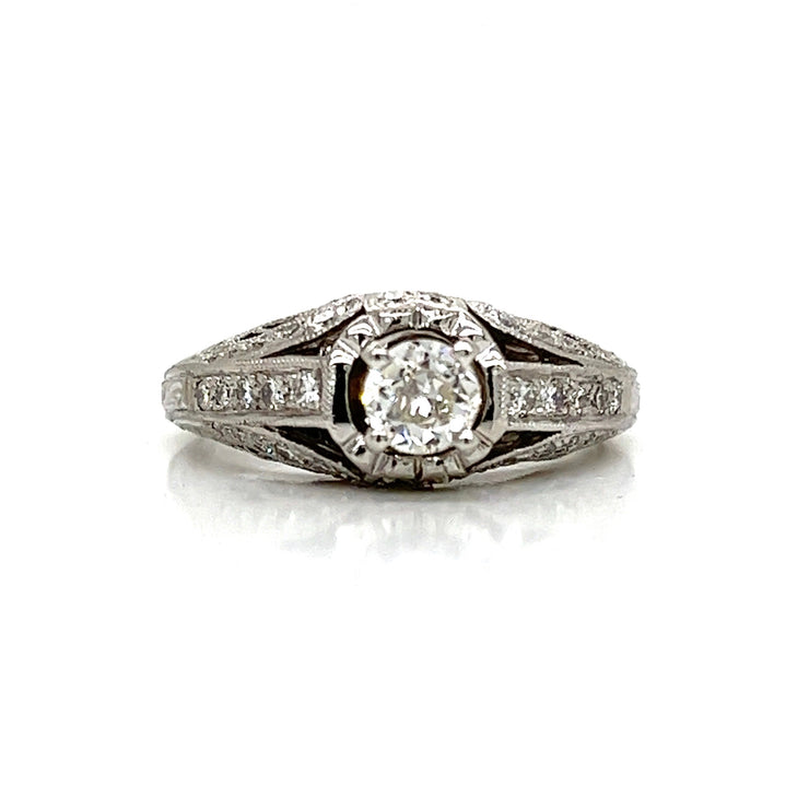 A timeless engagement ring with subtle brilliance and antique charm.