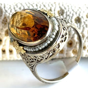 Heirloom Citrine and Pearl Ring in 14K -
Stunning 6.25ct oval citrine surrounded by seed pearls, absolute vintage charm.