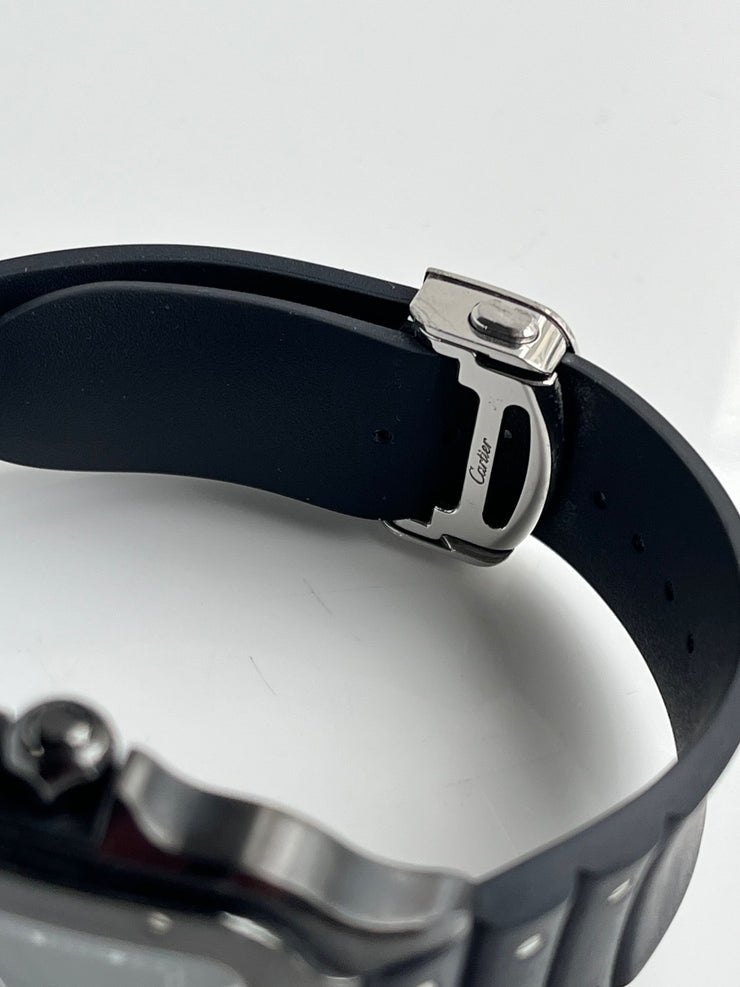 Close-up of a black rubber strap with  branded buckle.