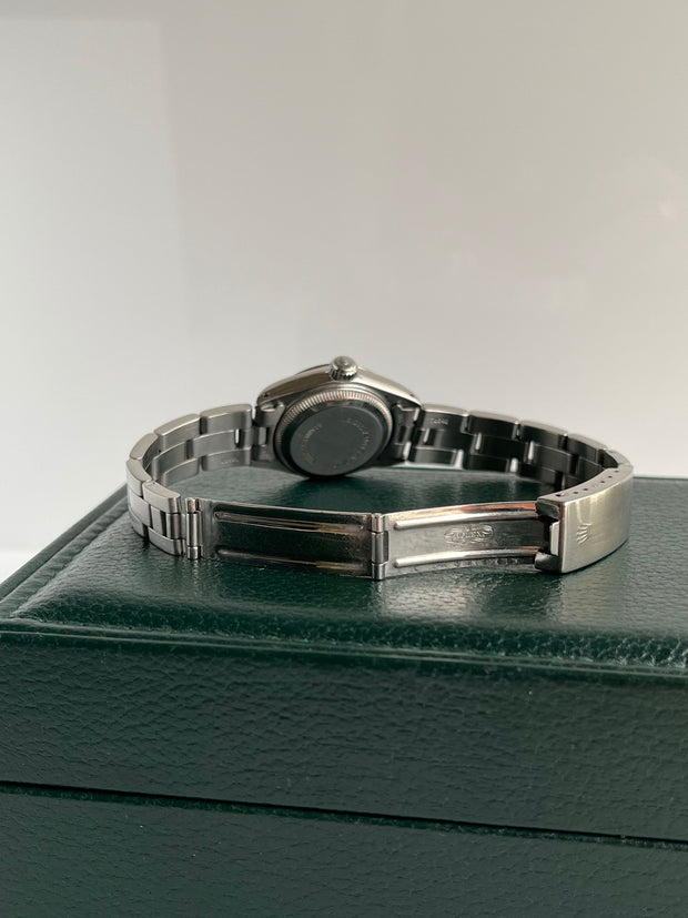 The Rolex shown with oyster fold over closure.
