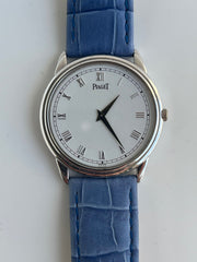 White Dial with Roman Numerals and Vertical Guilloché Center.