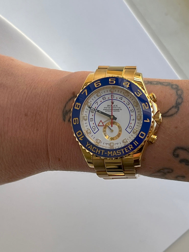 Gold Rolex Yacht Master II shown on model.