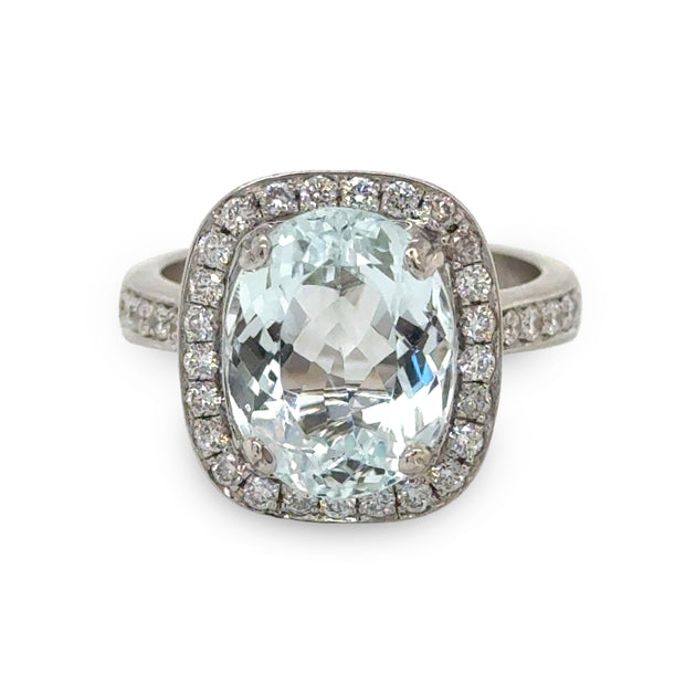 Stunning Retro Natural Aquamarine and Diamond Ring featuring a 5.50-carat aquamarine center stone and 1.0 carat of round brilliant-cut diamonds