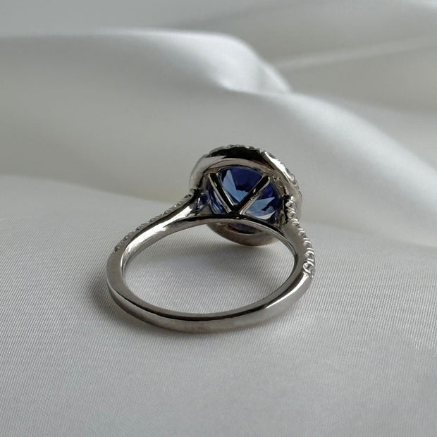 Back of luxury gemstone ring featuring deep blue sapphire and sparkling diamonds