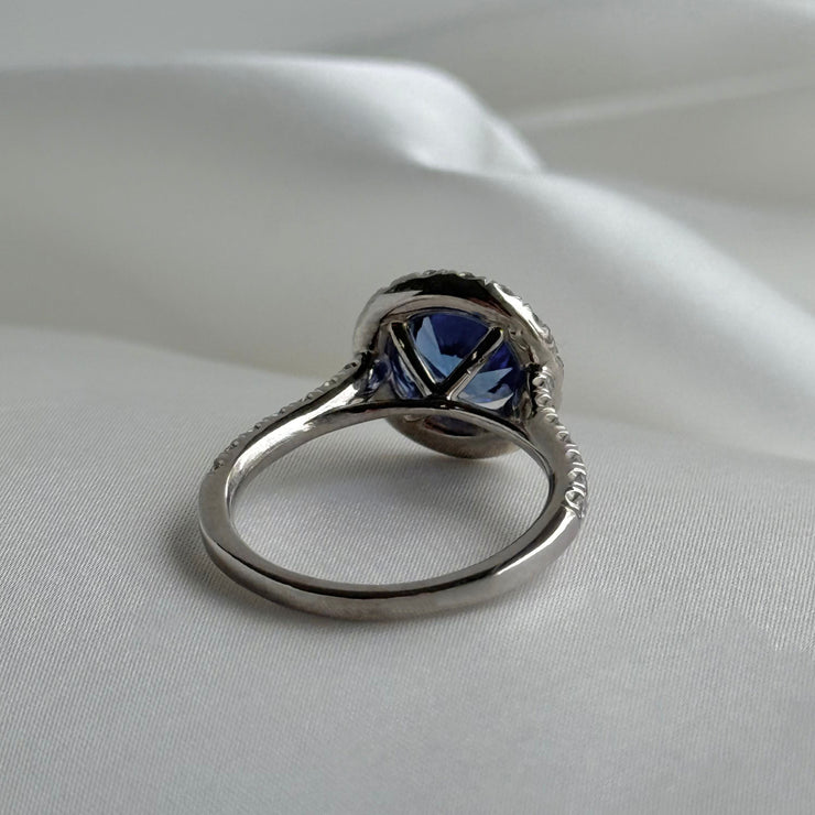 Back of luxury gemstone ring featuring deep blue sapphire and sparkling diamonds