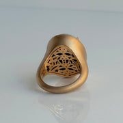 Intricate back detailing of 18k rose gold turquoise statement ring