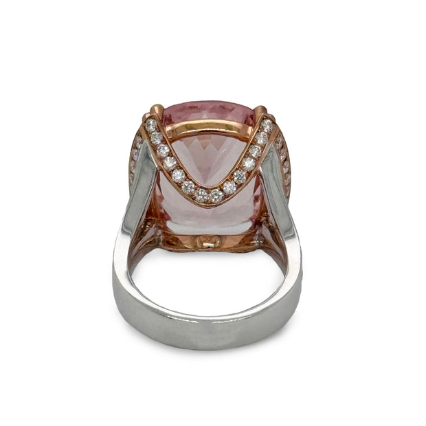 Cushion-cut pink kunzite gemstone glowing with luminous brilliance in rose gold setting.