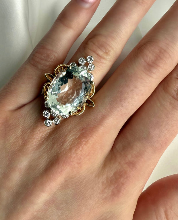 Model wearing the Two-Tone Gold Estate Ring with aquamarine and diamonds, perfect for March birthday gifts.