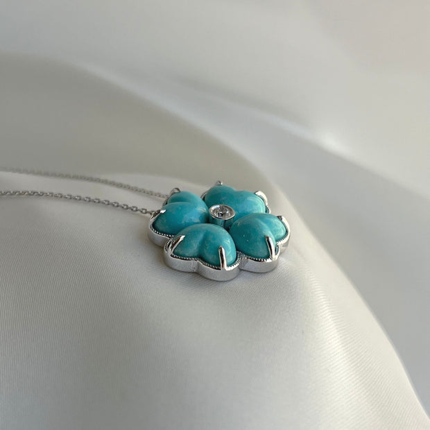 Turquoise gemstone clover necklace with white gold setting and diamond accent