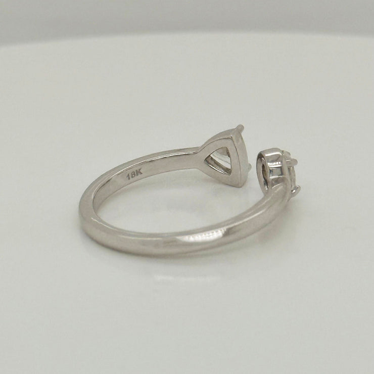 Luxury bypass diamond ring crafted in 18K white gold with oval and trillion stones
