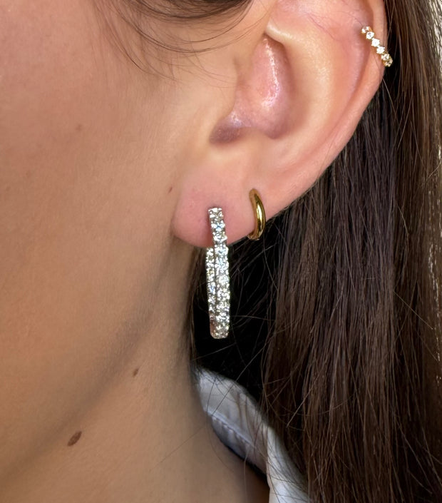 Stunning Inside Out Diamond Hoop Earrings with 2.5 ct of radiant diamonds, designed for elegance and versatility in 14K white gold on a model.