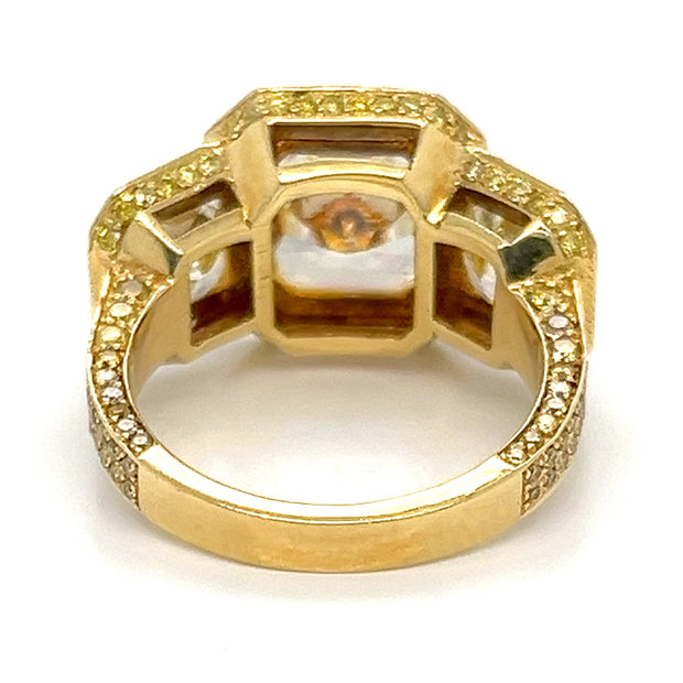 Yellow diamond three stone halo ring