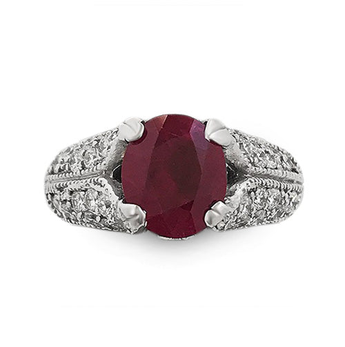14k white gold ring with 1.96 ct oval ruby and 0.65 ct pavé round diamonds on engraved milgrain band.