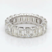 Beautifully crafted eternity ring showcasing a seamless flow of emerald-cut diamonds totaling 6.3 carats.