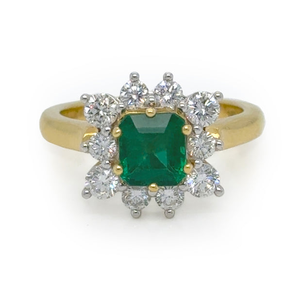 Stunning Floral-Inspired Emerald Ring Featuring a 1.24-Carat Emerald Surrounded by a Halo of Round Diamonds that Create a Blossom Effect