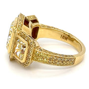 Yellow diamond three stone halo ring