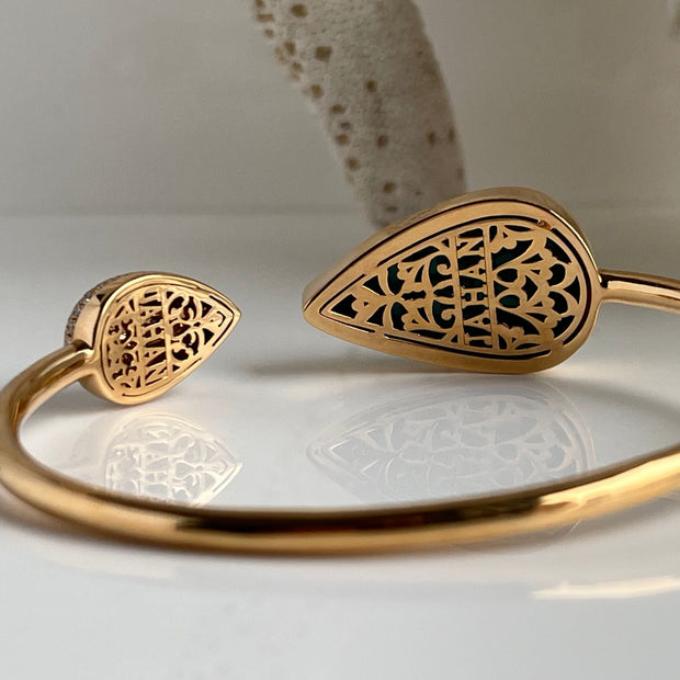 Back of 18K yellow gold turquoise and diamond bangle showing intricate engraved detail