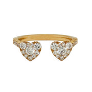 Rose gold bypass ring with heart-shaped diamond designs on a white background
