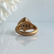 Intricate back design of 18k rose gold turquoise ring with fine craftsmanship